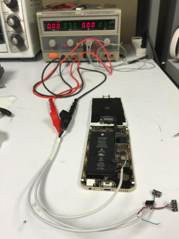 Phone board connected to lab power supply during DC power injection testing