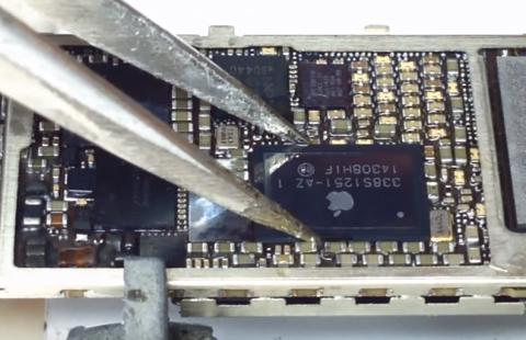 Microscope view of PMIC rework on Apple device board